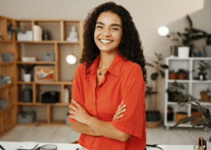 Smiling store associate crossing arms